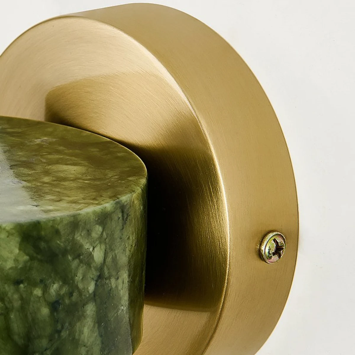 Brass wall plate and jade stone edge detail