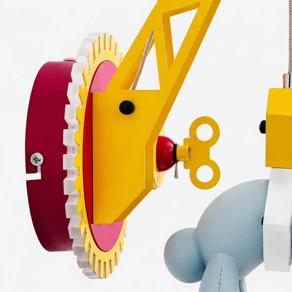 Close-up of crane arm and red gear housing
