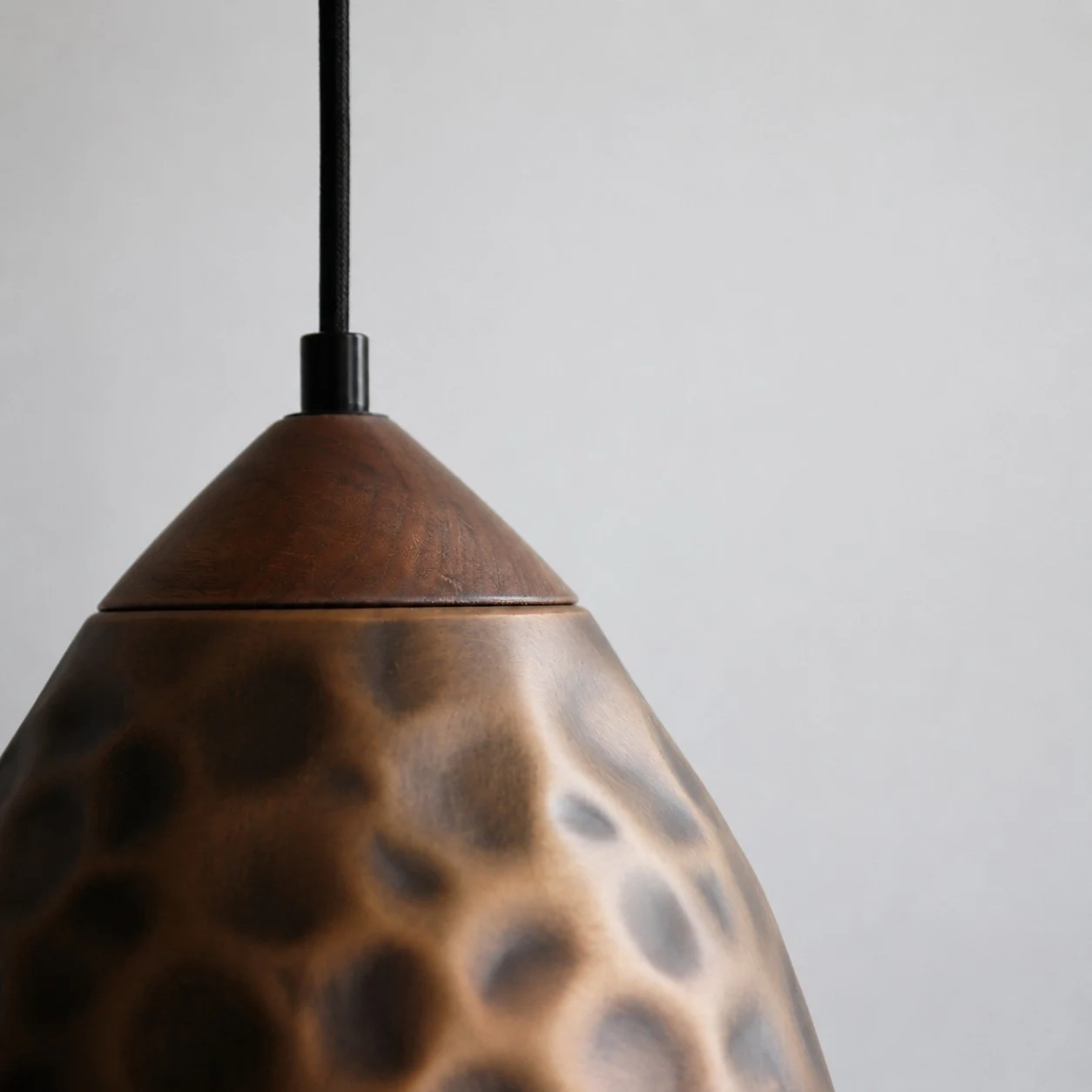 Close view of hammered antique copper pendant shade texture