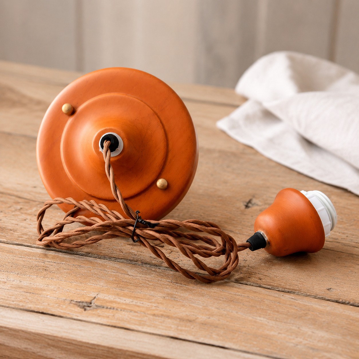 Warm brown cord and ceiling hardware detail