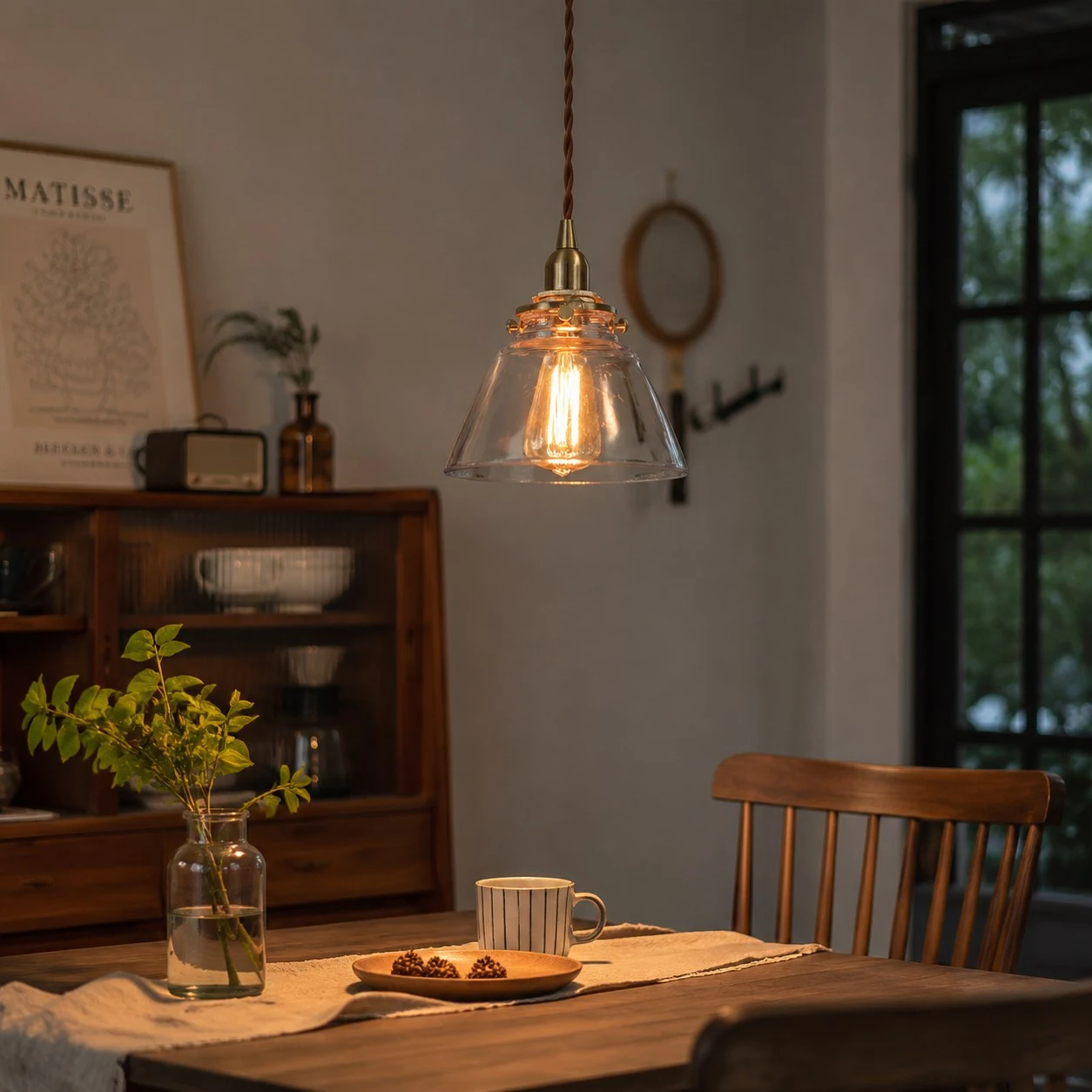 Vintage glass pendant light creating warm dining bar atmosphere