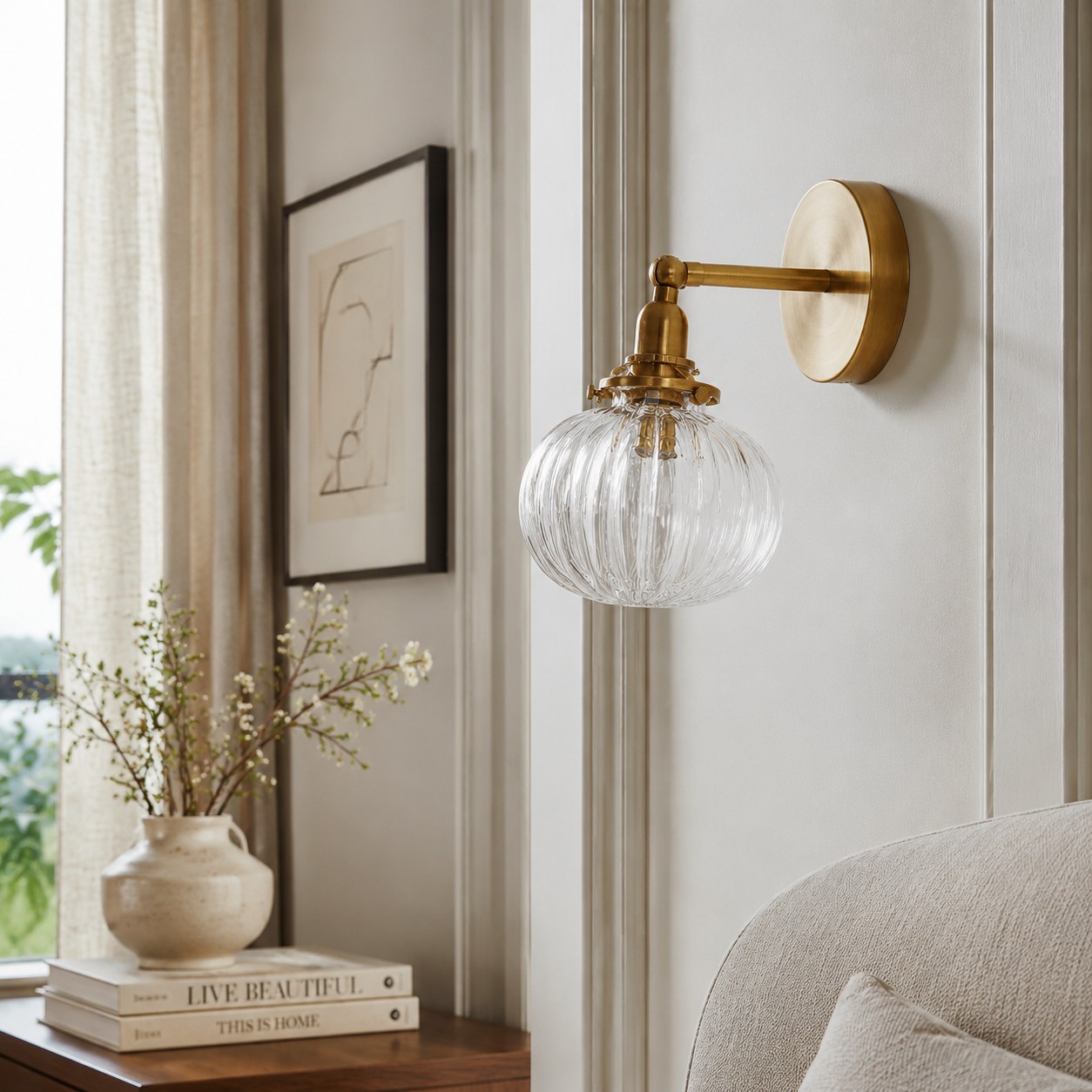 Brass ribbed glass wall light in a calm bedroom corner