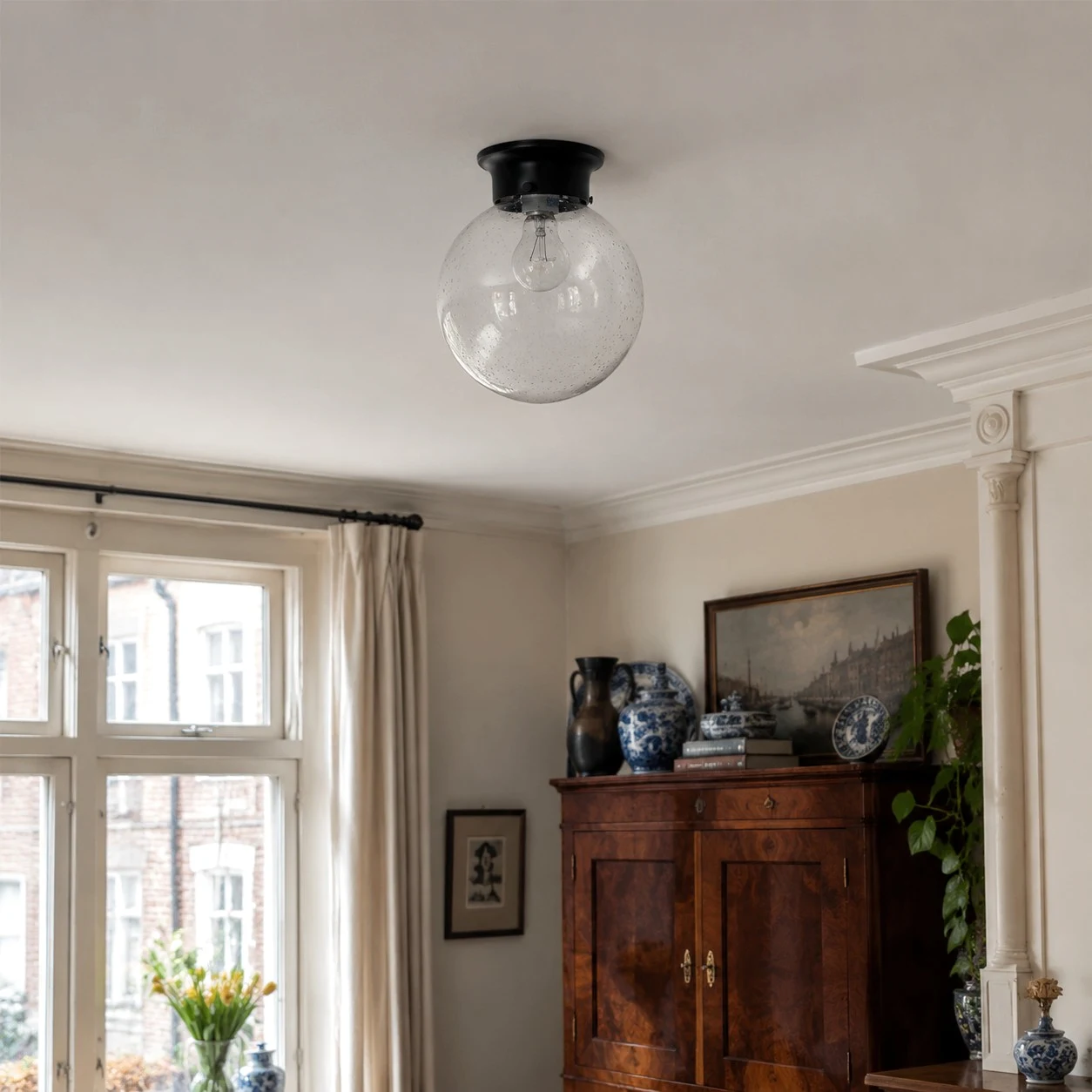 Glass ceiling lamp installed close to the ceiling in a classic room