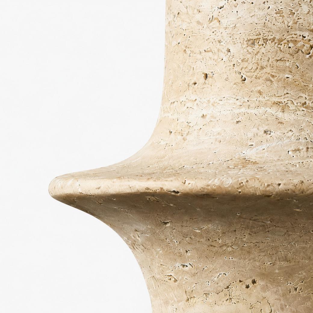 Close detail of polished travertine rim with natural pores and warm beige variation