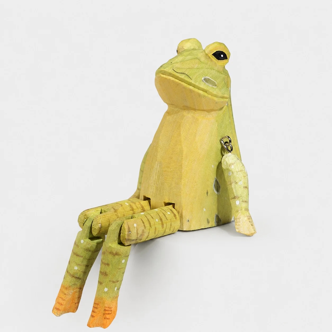 Hand-carved wooden frog ornament