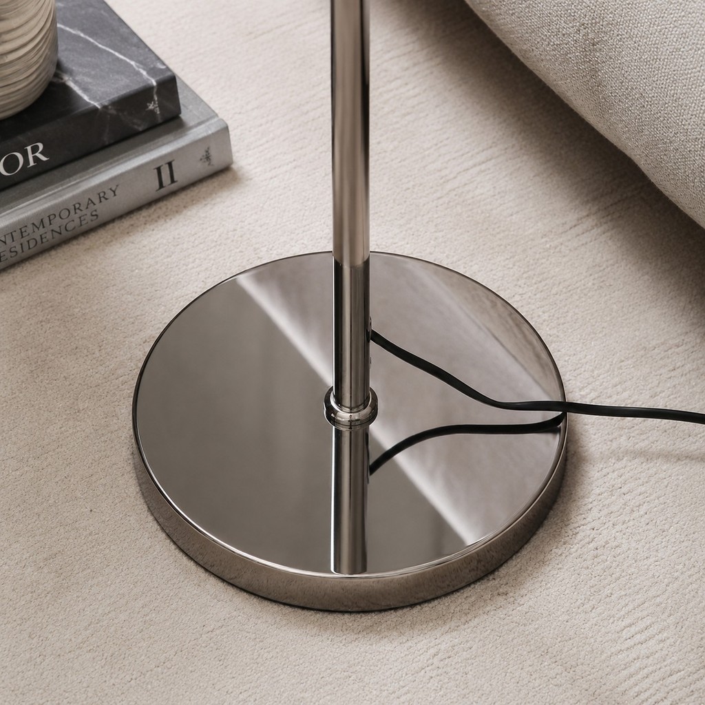 Polished chrome floor lamp base and stem detail