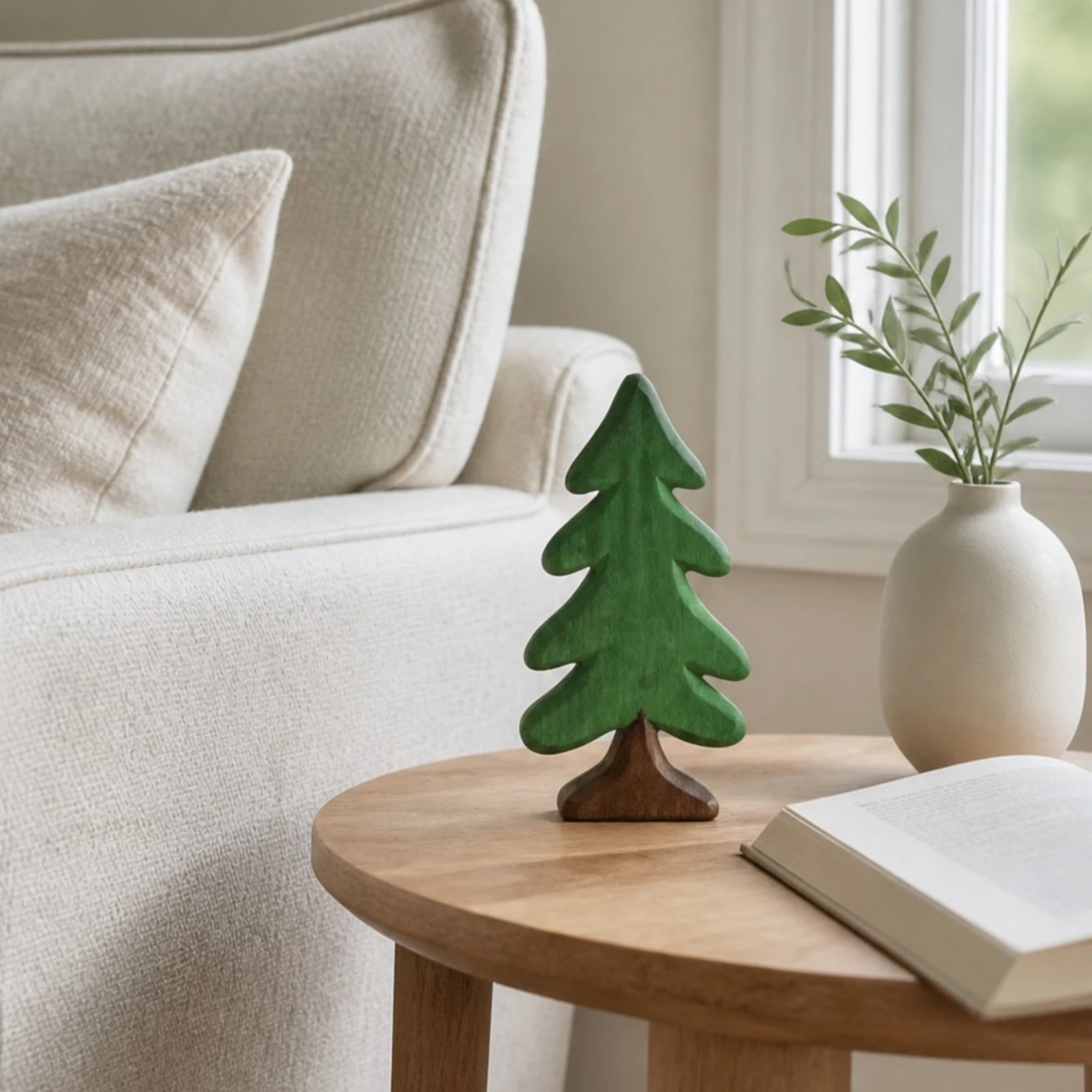 Green pine tree ornament on a coffee table