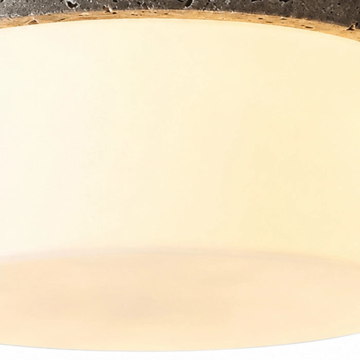 Close detail of warm glass shade and soft diffuser glow
