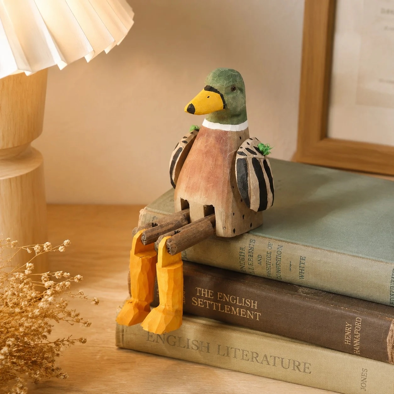 Hand-carved wooden mallard duck ornament styled on a tabletop edge