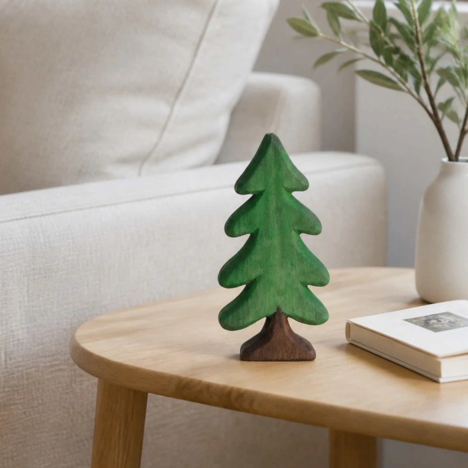 Small pine tree ornament in a living room setting
