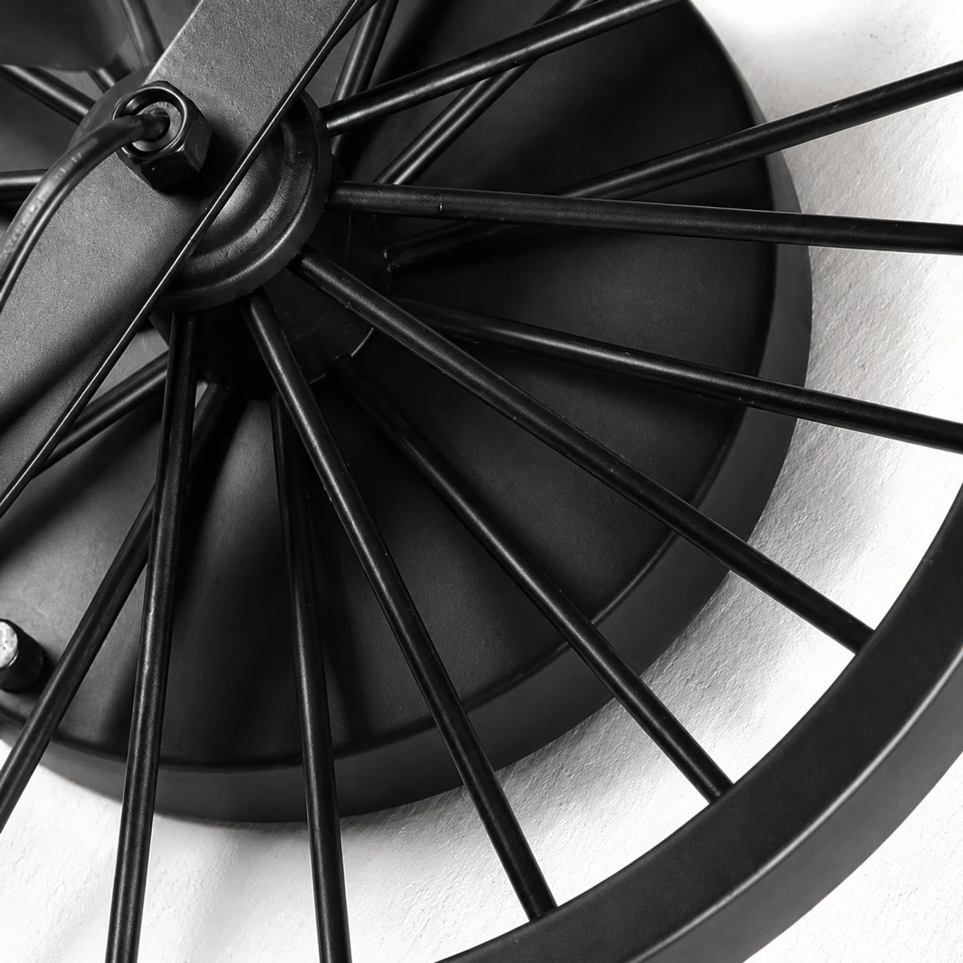 Close view of the black wagon wheel backplate and spoke detail