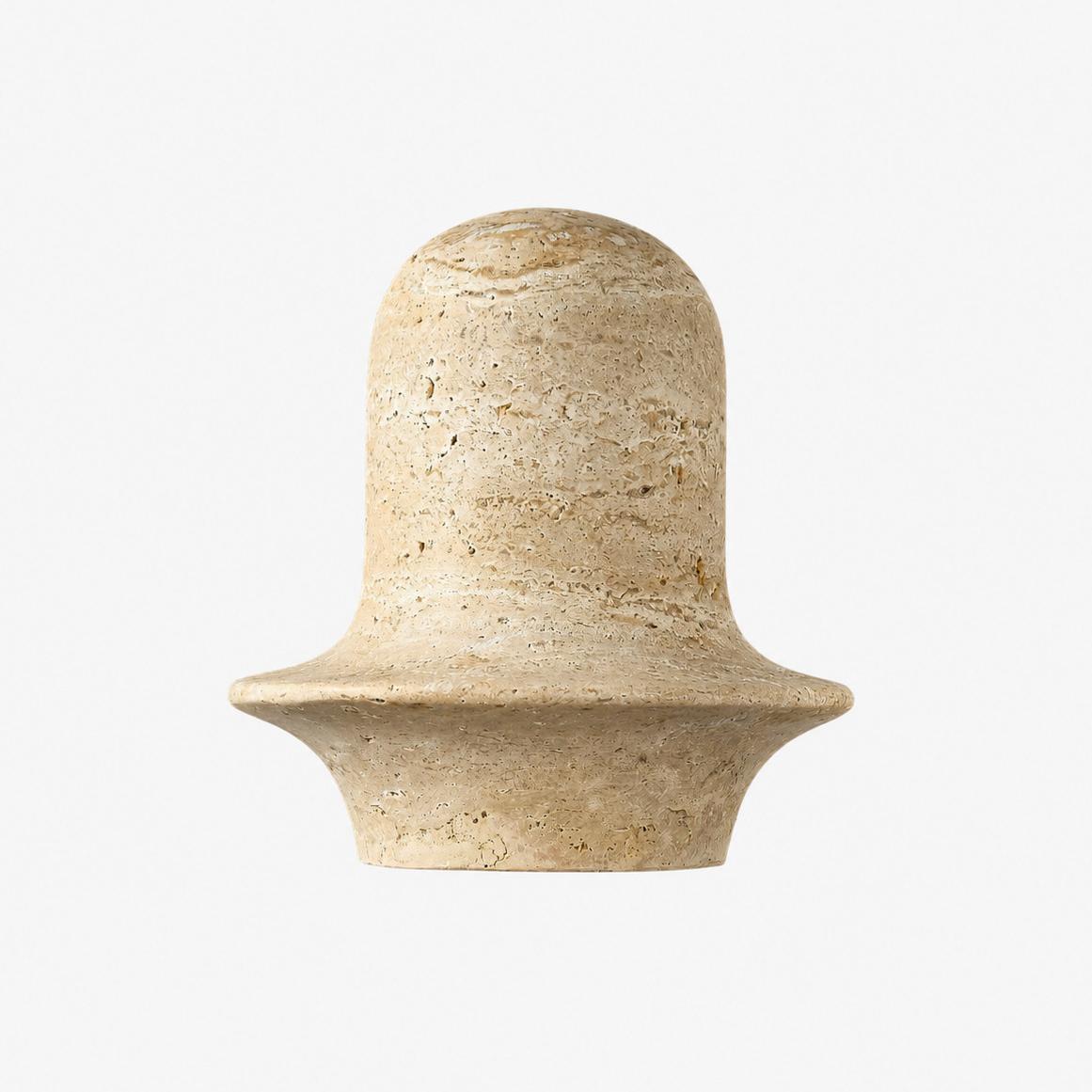 Travertine wall sconce front view showing rounded stone shade and flared rim
