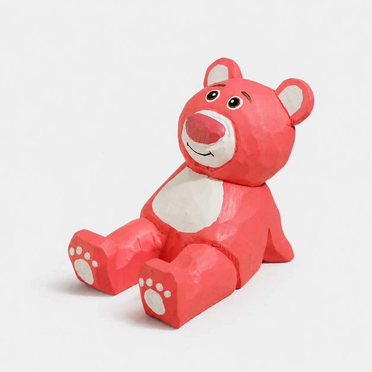Hand-carved wooden animal phone stand