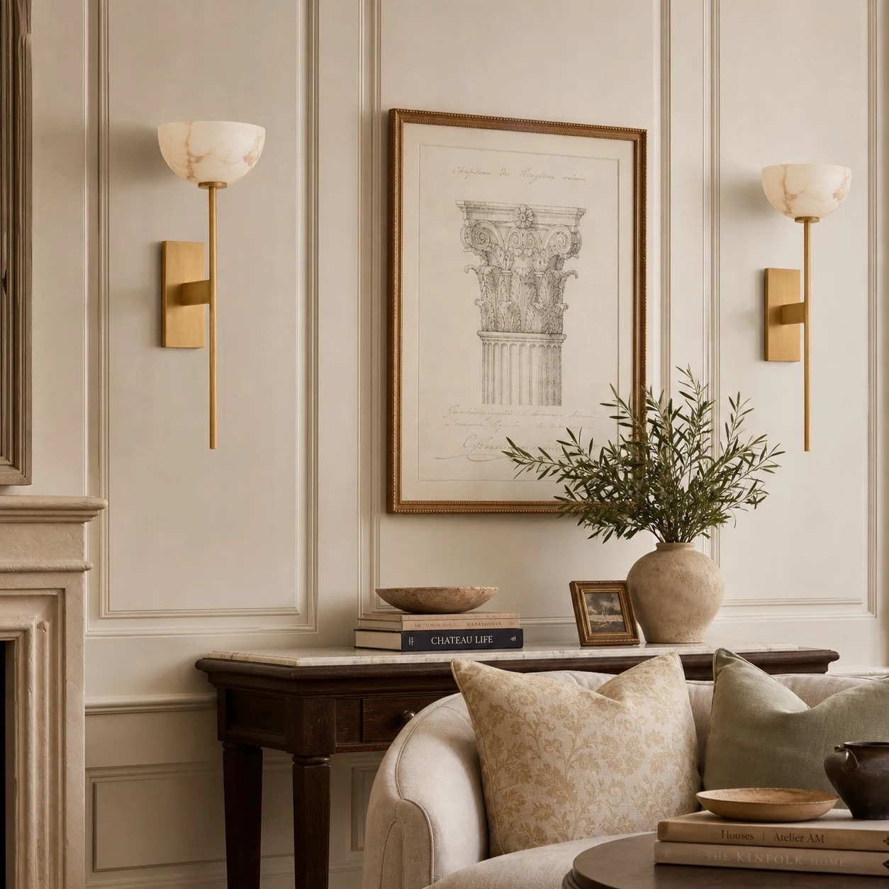 Natural brass wall sconces beside framed art