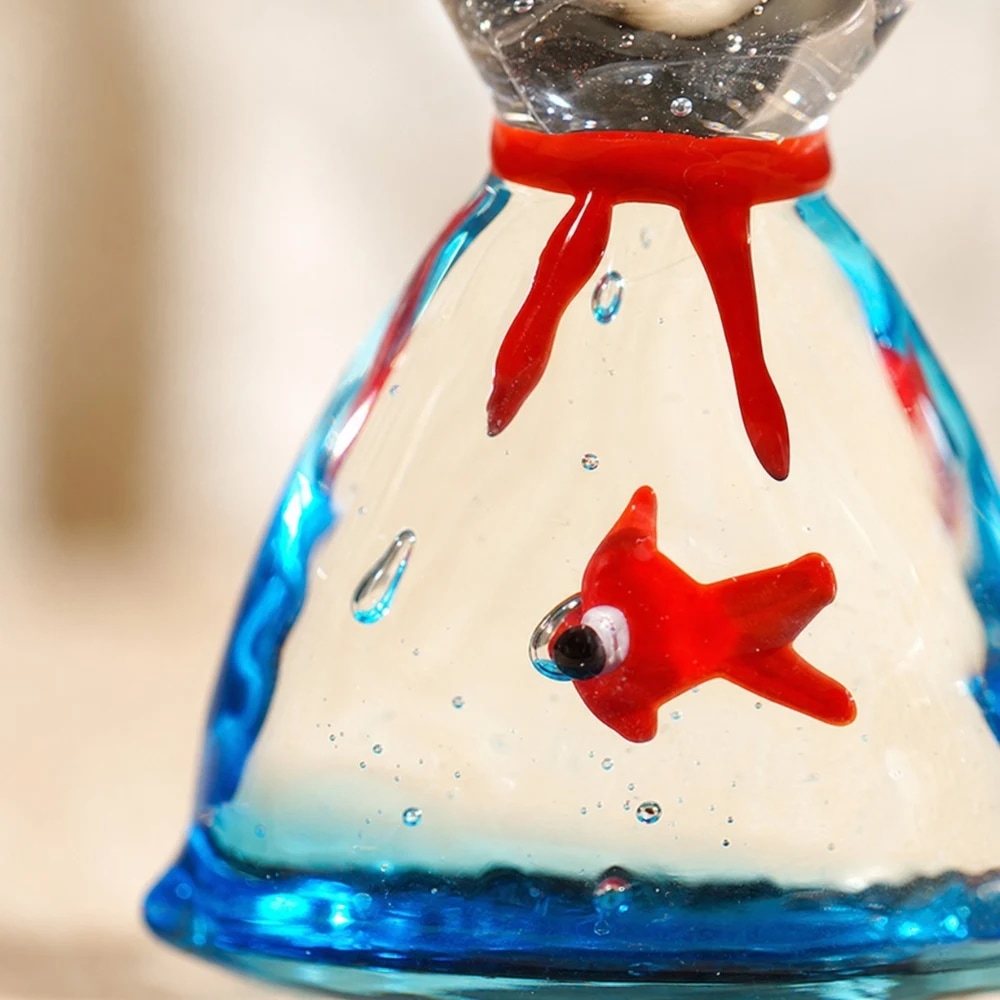 Close detail of red and blue handmade glass fish ornament