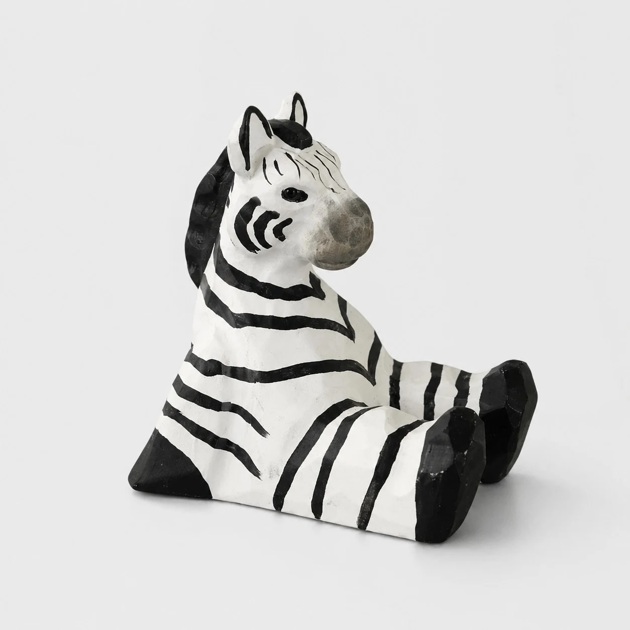 Hand-carved wooden animal phone stand