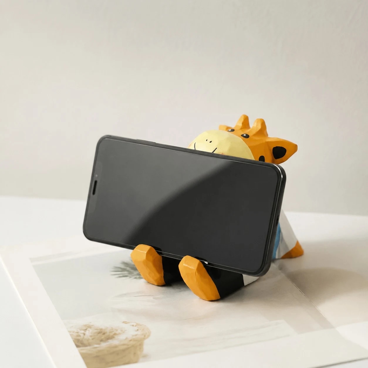 Wooden animal phone stand scene view
