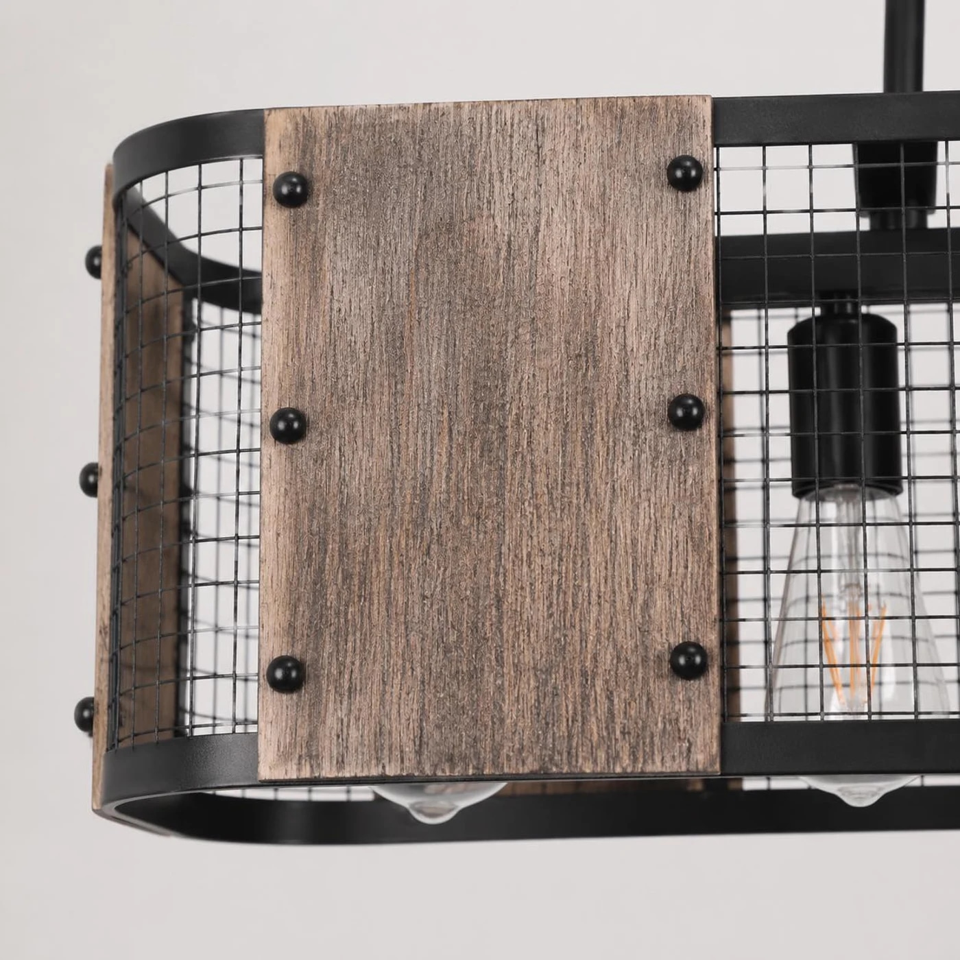 Close view of wood grain shade panel and black iron mesh