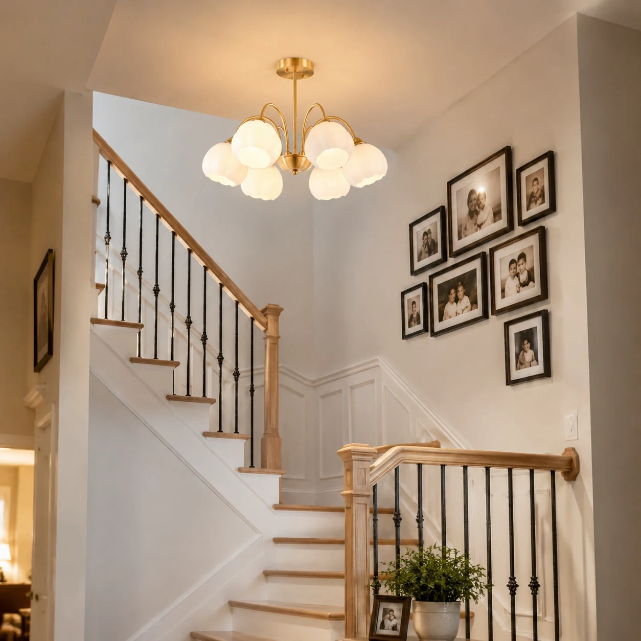 Six-arm chandelier installed above a staircase
