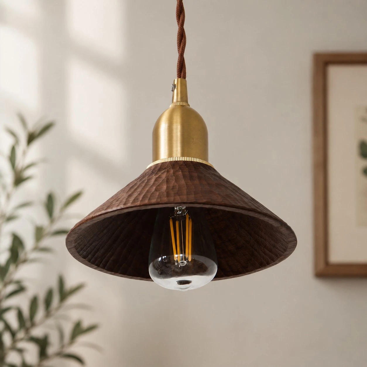 Black walnut carved pendant shade shown in a bright interior