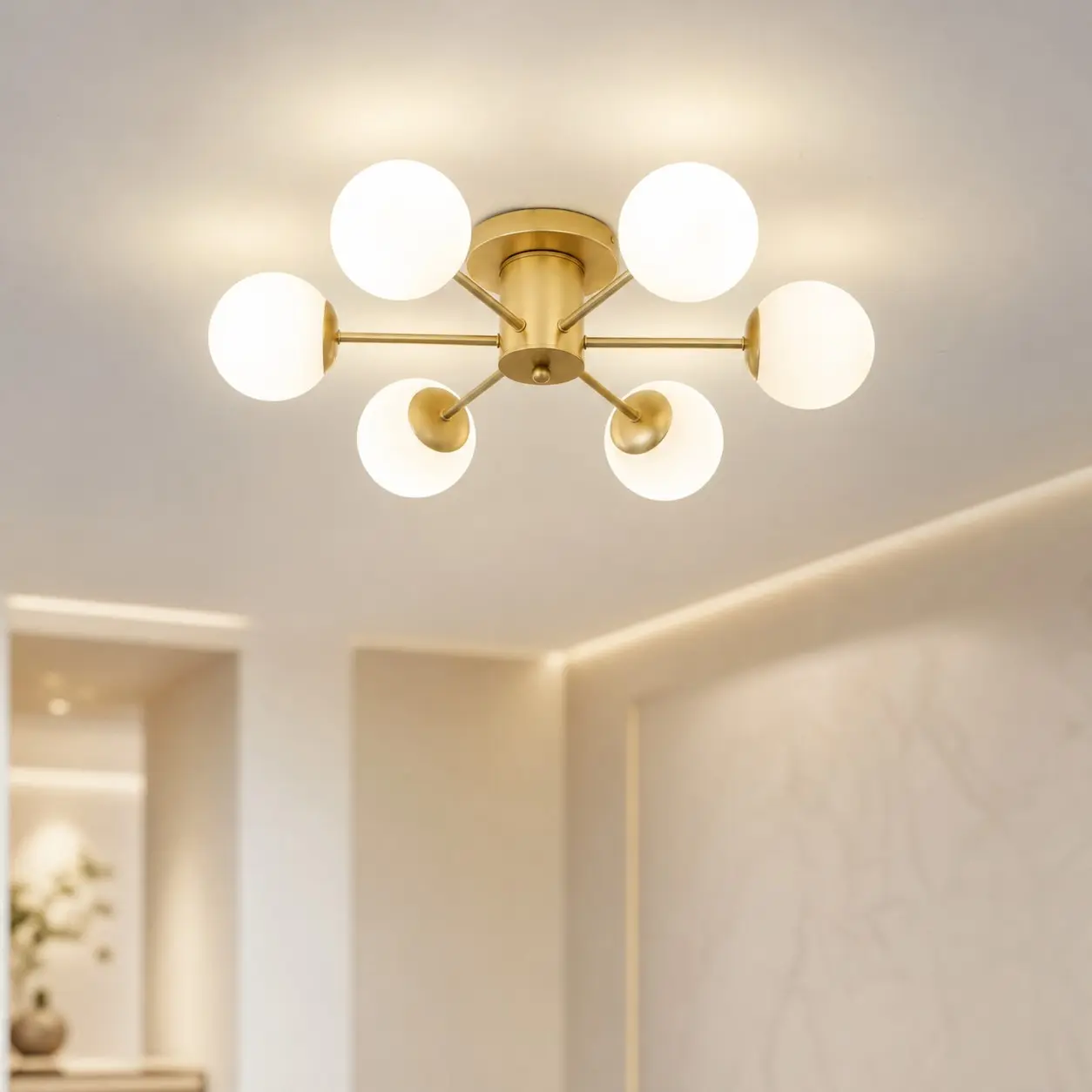 Six-head gold globe ceiling light in a bright modern interior
