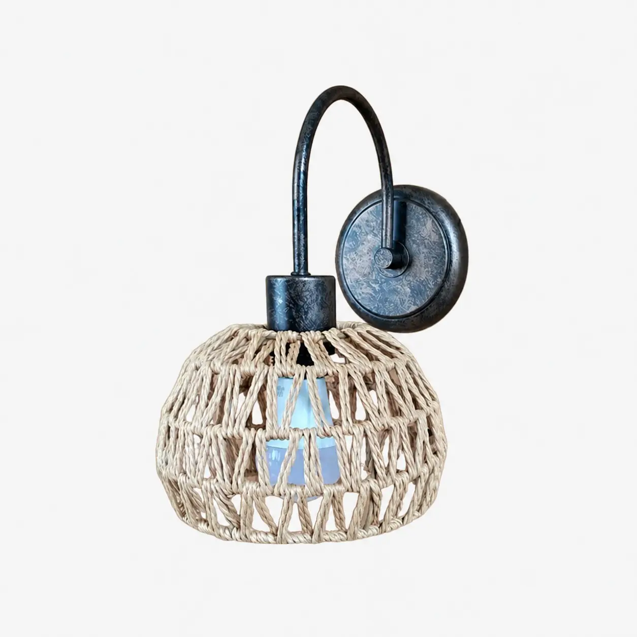 Shade A woven rattan wall sconce in antique brass