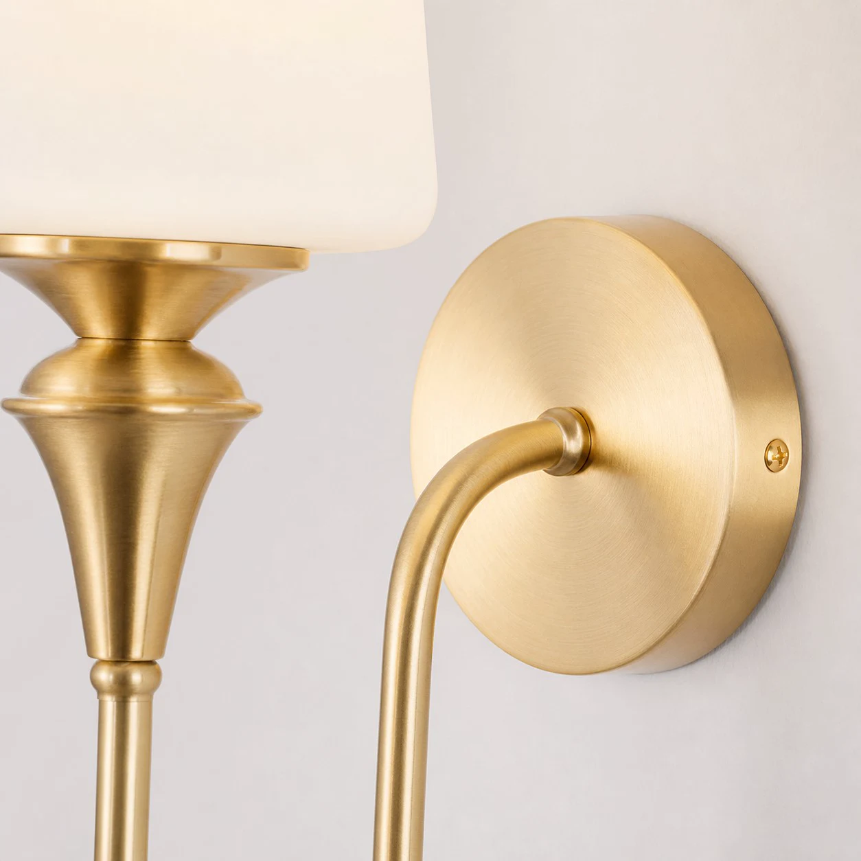 Close-up of the brass arm and wall plate
