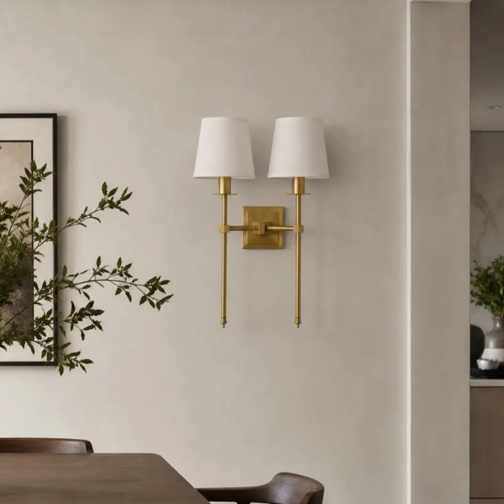 Double Head brass wall sconce in a modern dining room