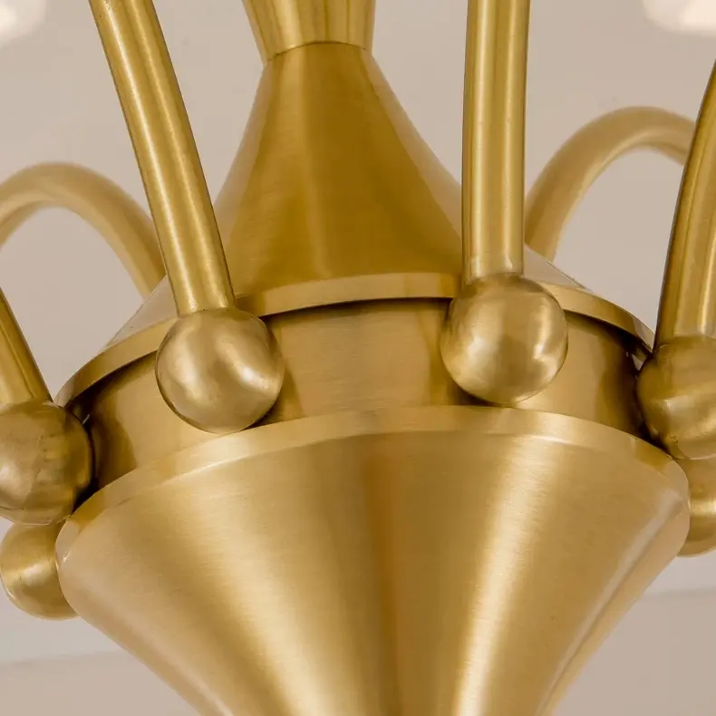 Brushed gold central body and arm connection detail