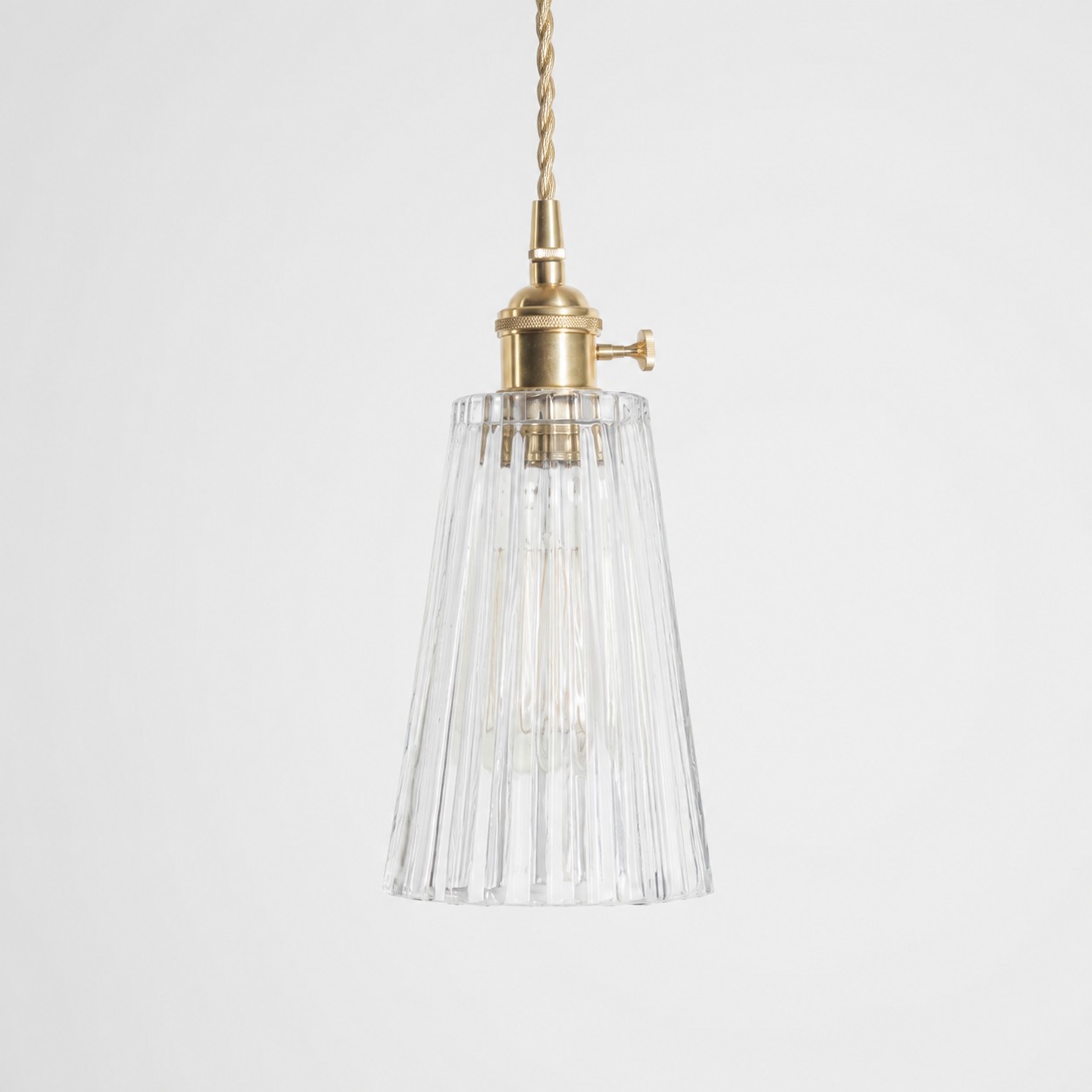 Style G textured glass shade with antique brass E27 socket, front view