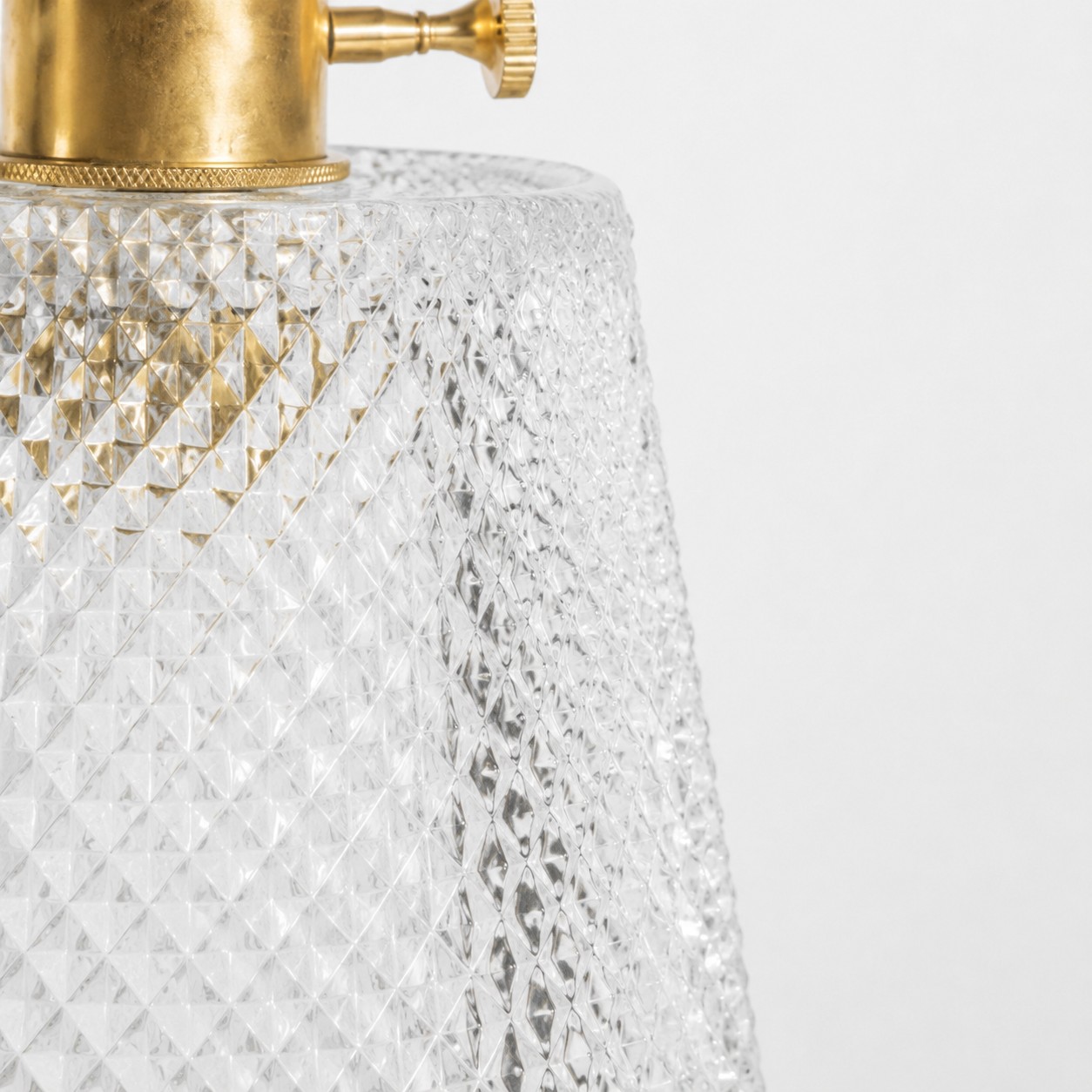 pressed glass texture and sealed brass rim detail