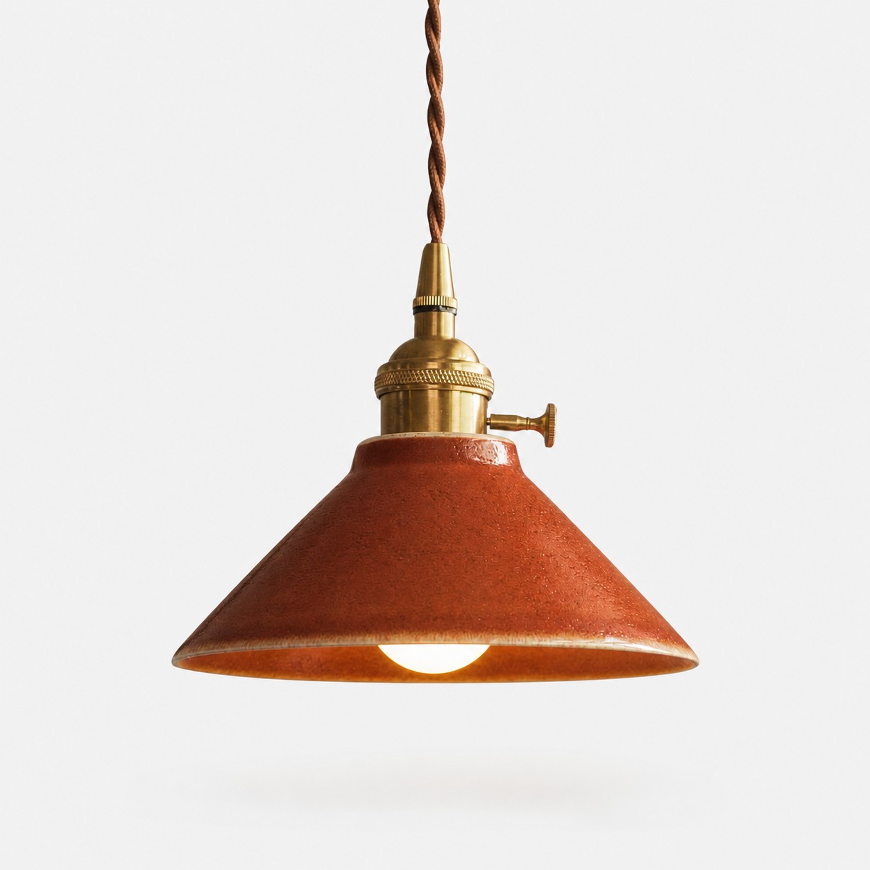 Complete russet glazed ceramic pendant light with antique brass-finished hardware