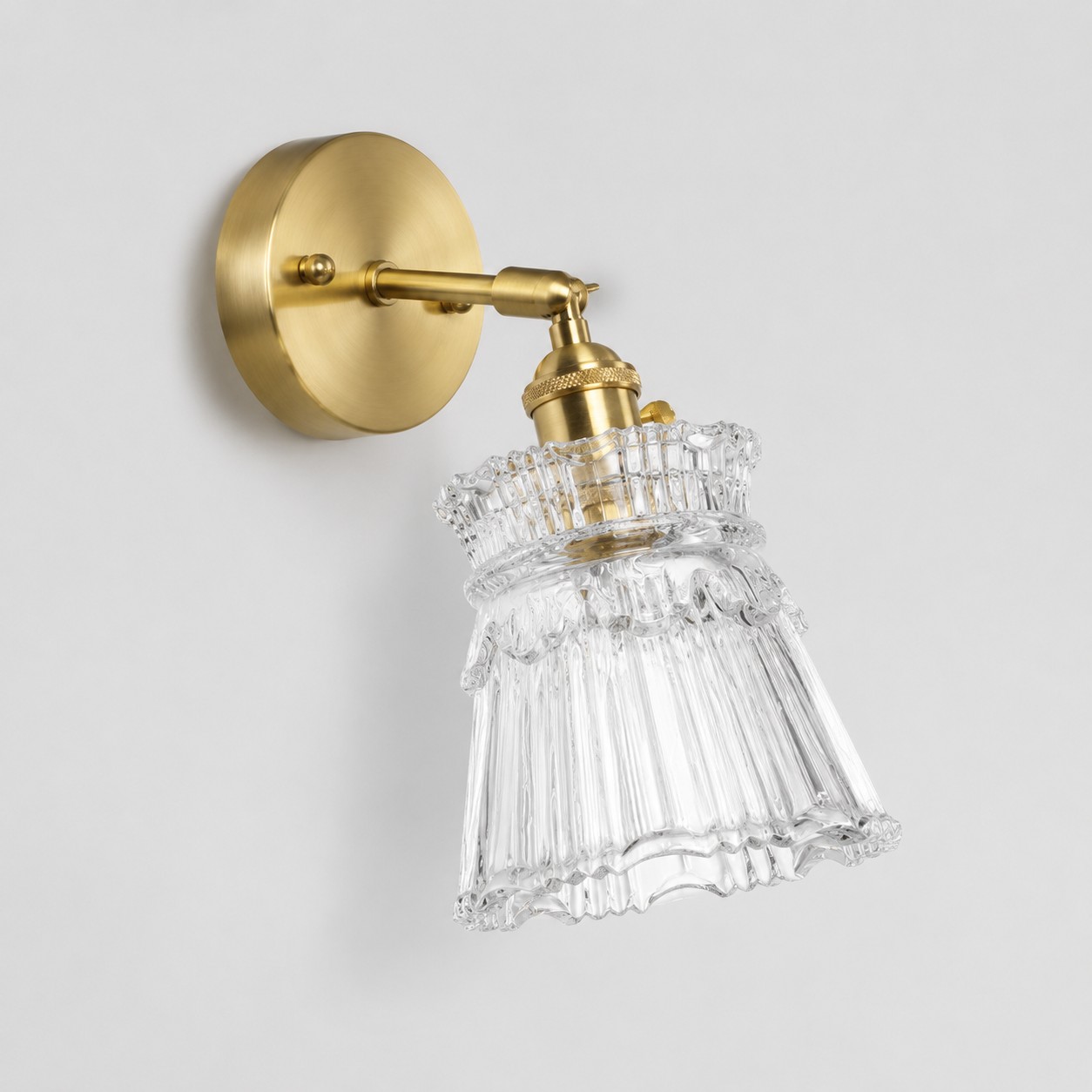 Clear glass wall light with brass arm, XZ shade 15 cm diameter and 14 cm high