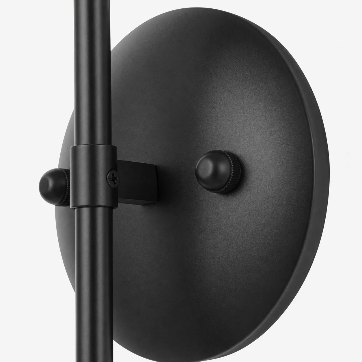 Black metal wall plate and arm connection detail