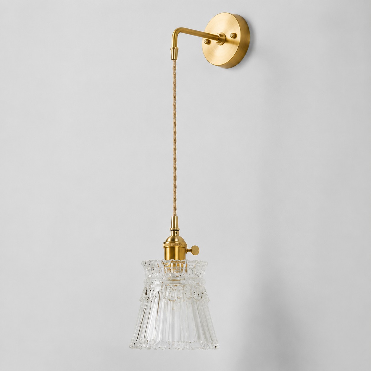 Clear glass wall light with brass arm, XW shade 15 cm diameter and 14 cm high