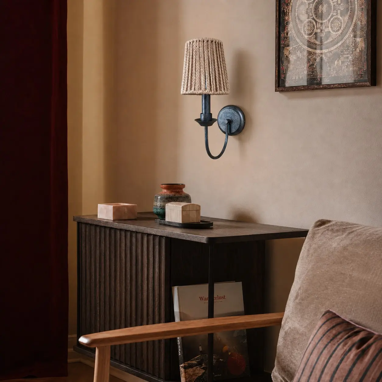 Fabric wall sconce installed above a dark console