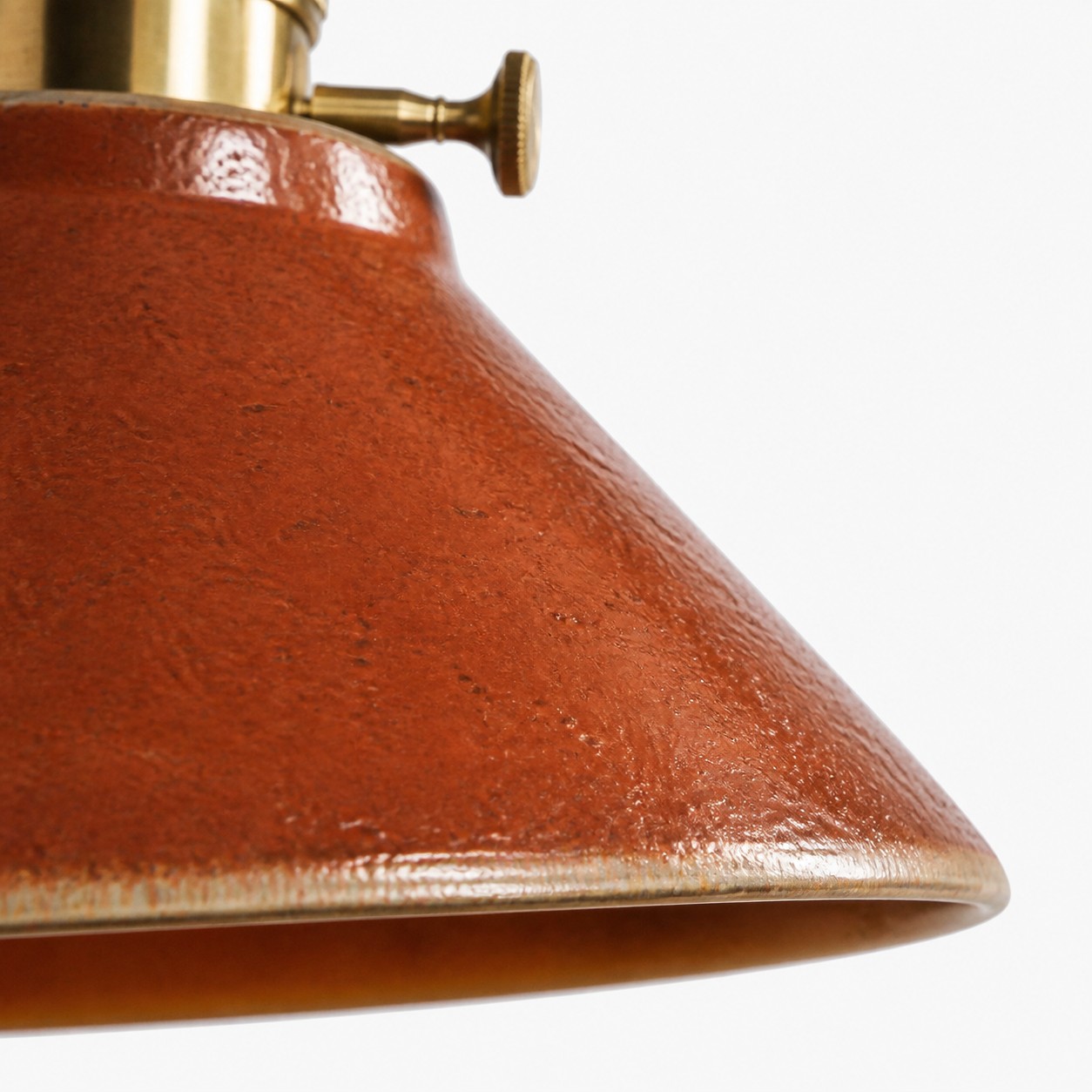 Russet glaze texture and pale ceramic rim detail