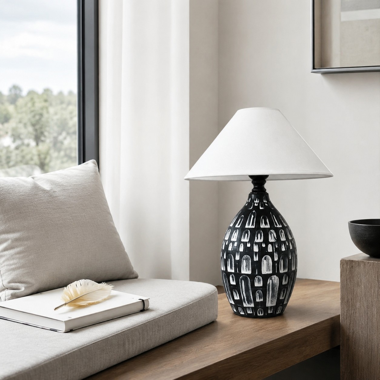 Ceramic table lamp beside a bright seating area