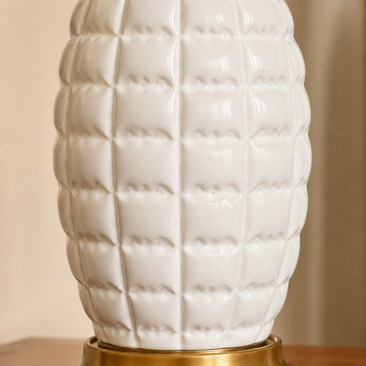 Close-up of sculpted white ceramic lamp base