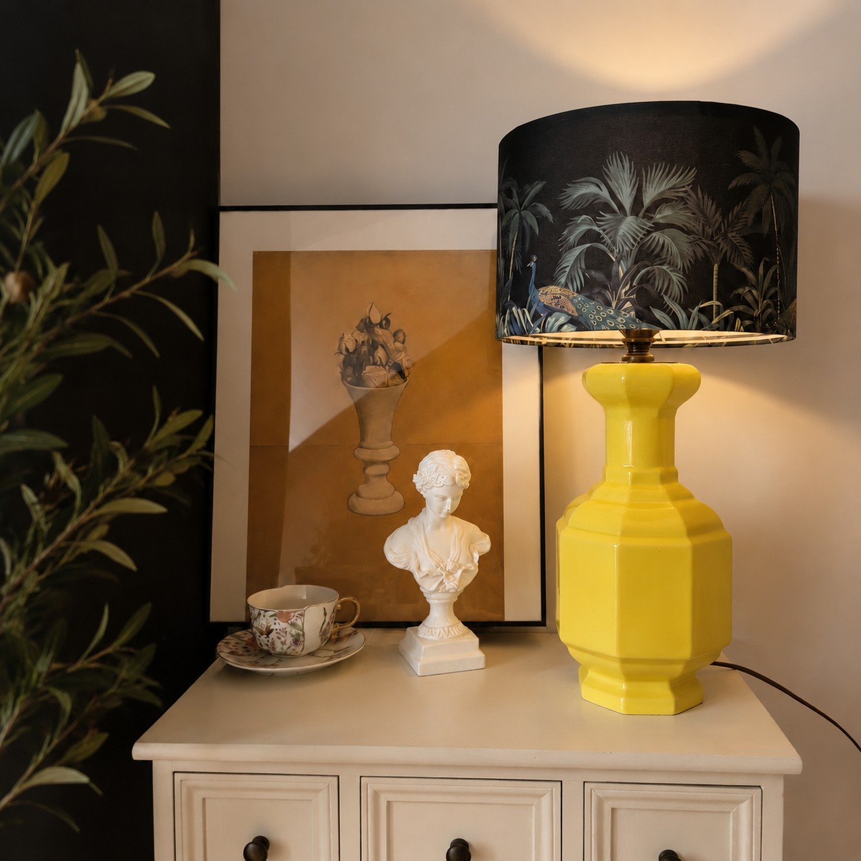 Faceted Lemon Yellow ceramic table lamp on a console