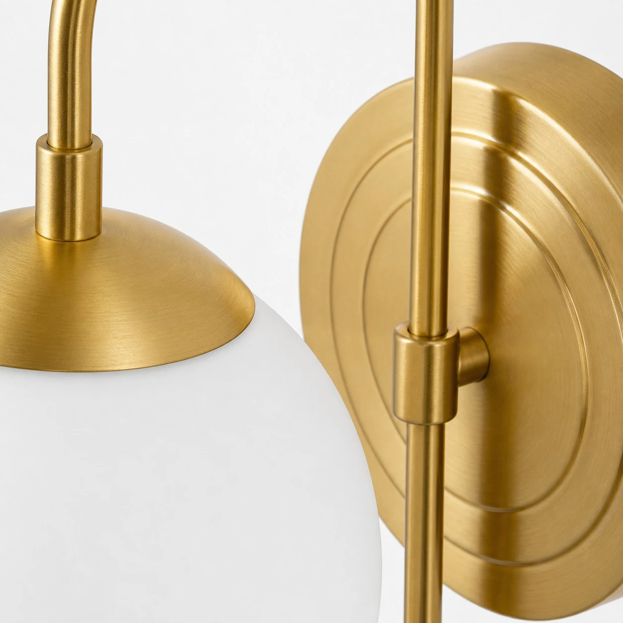 Gold metal shade holder and adjustable arm detail