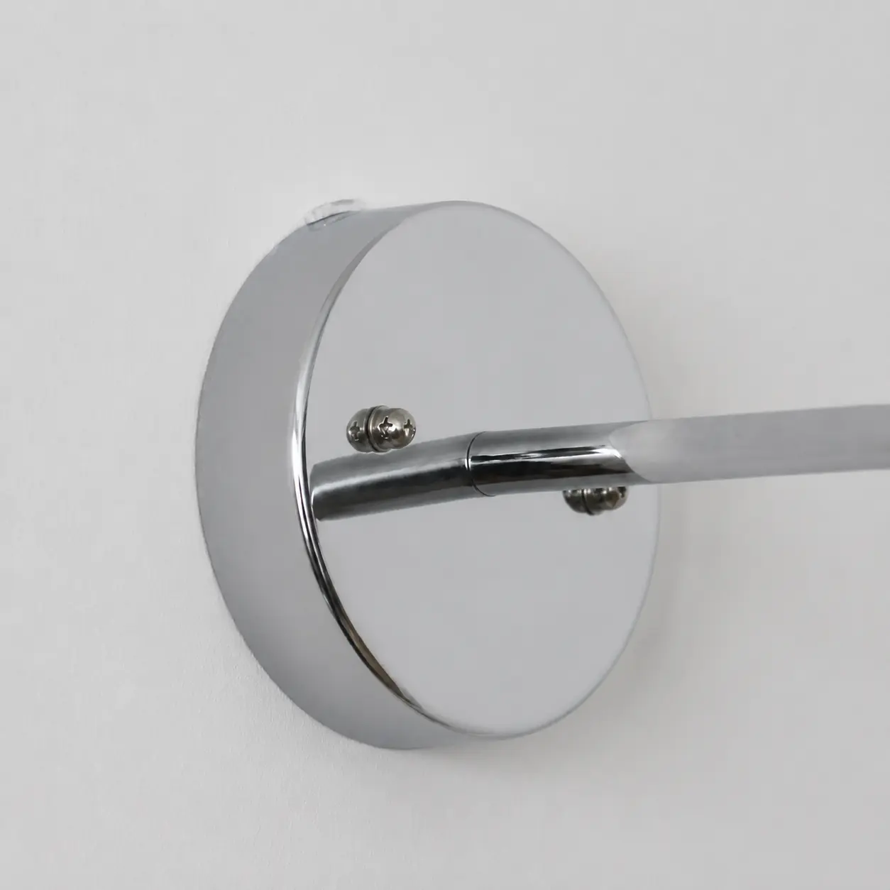 Wall plate and arm connection detail