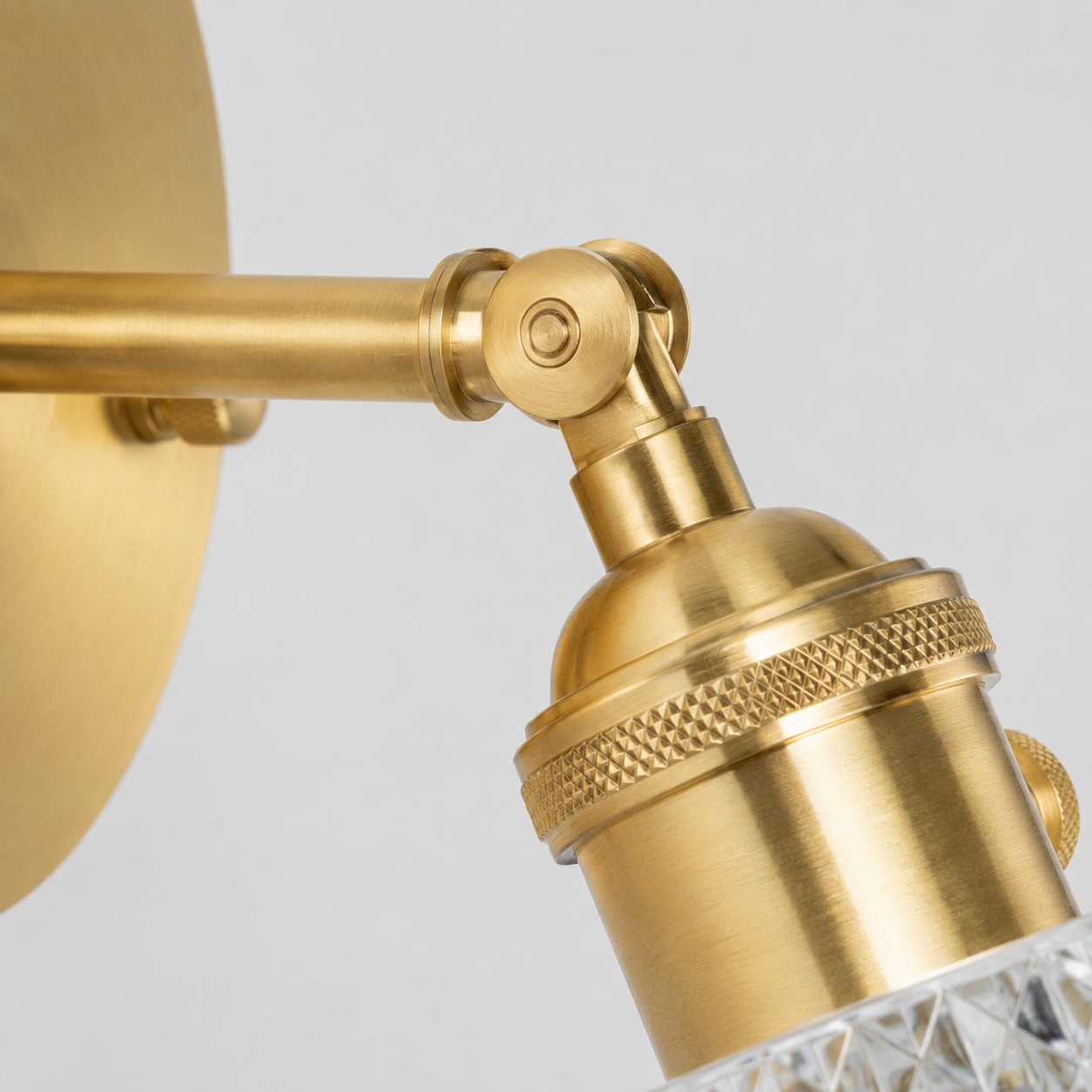Close view of brass lamp holder and adjustable joint