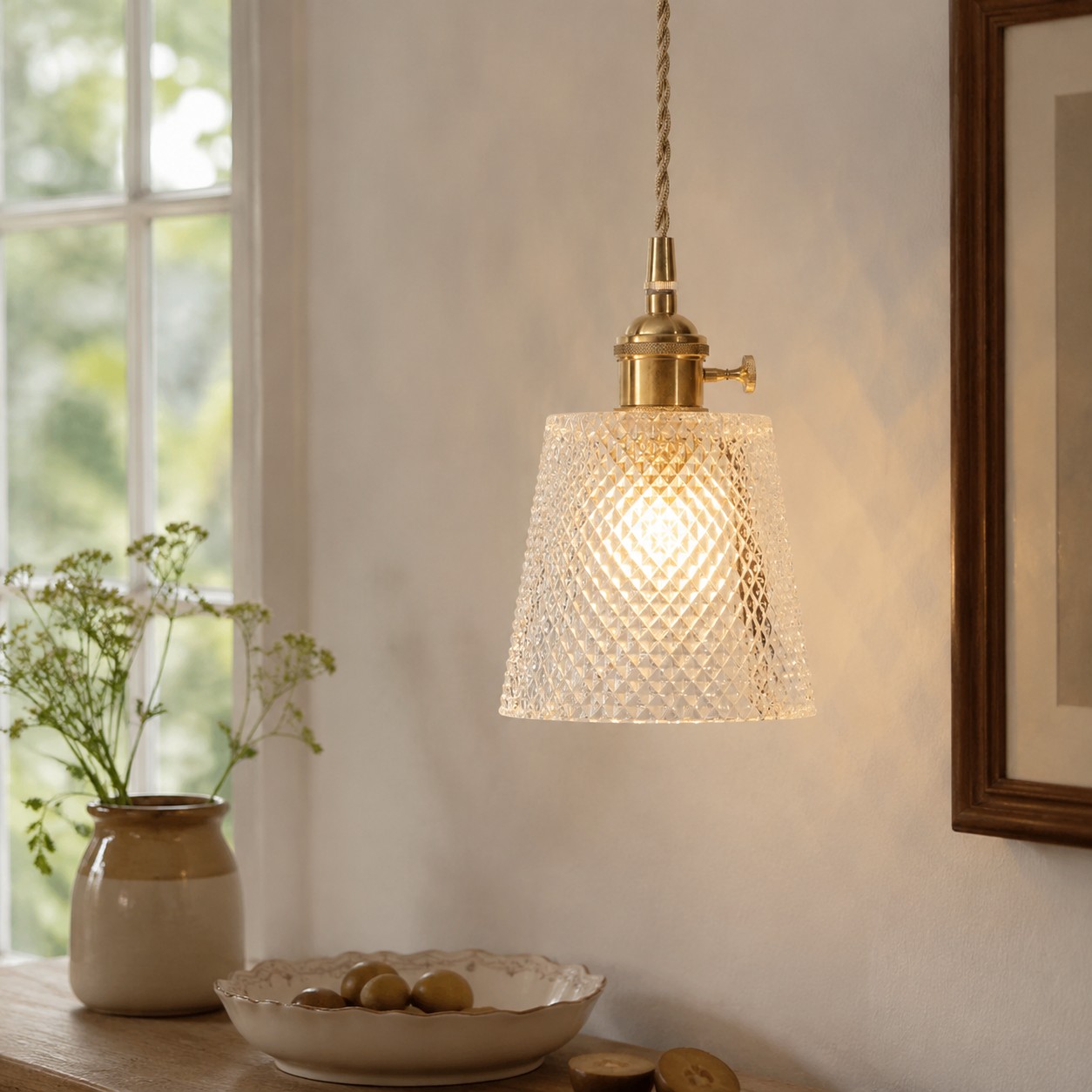 Style A diamond-textured glass pendant beside a sunlit dining table