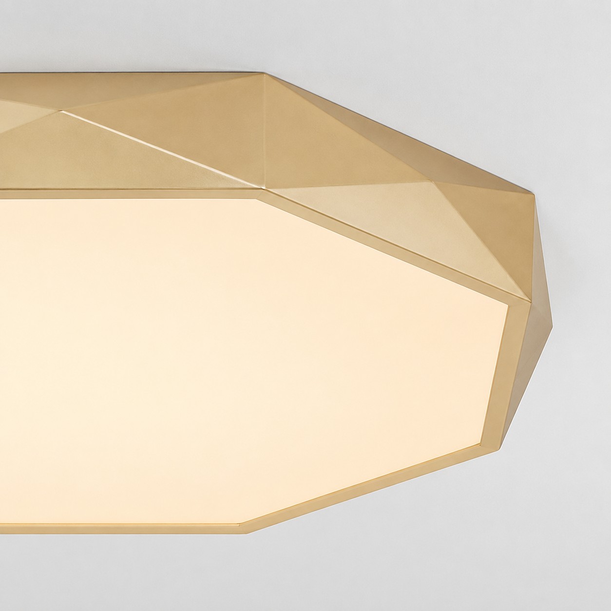 Close-up of the geometric gold frame and diffuser