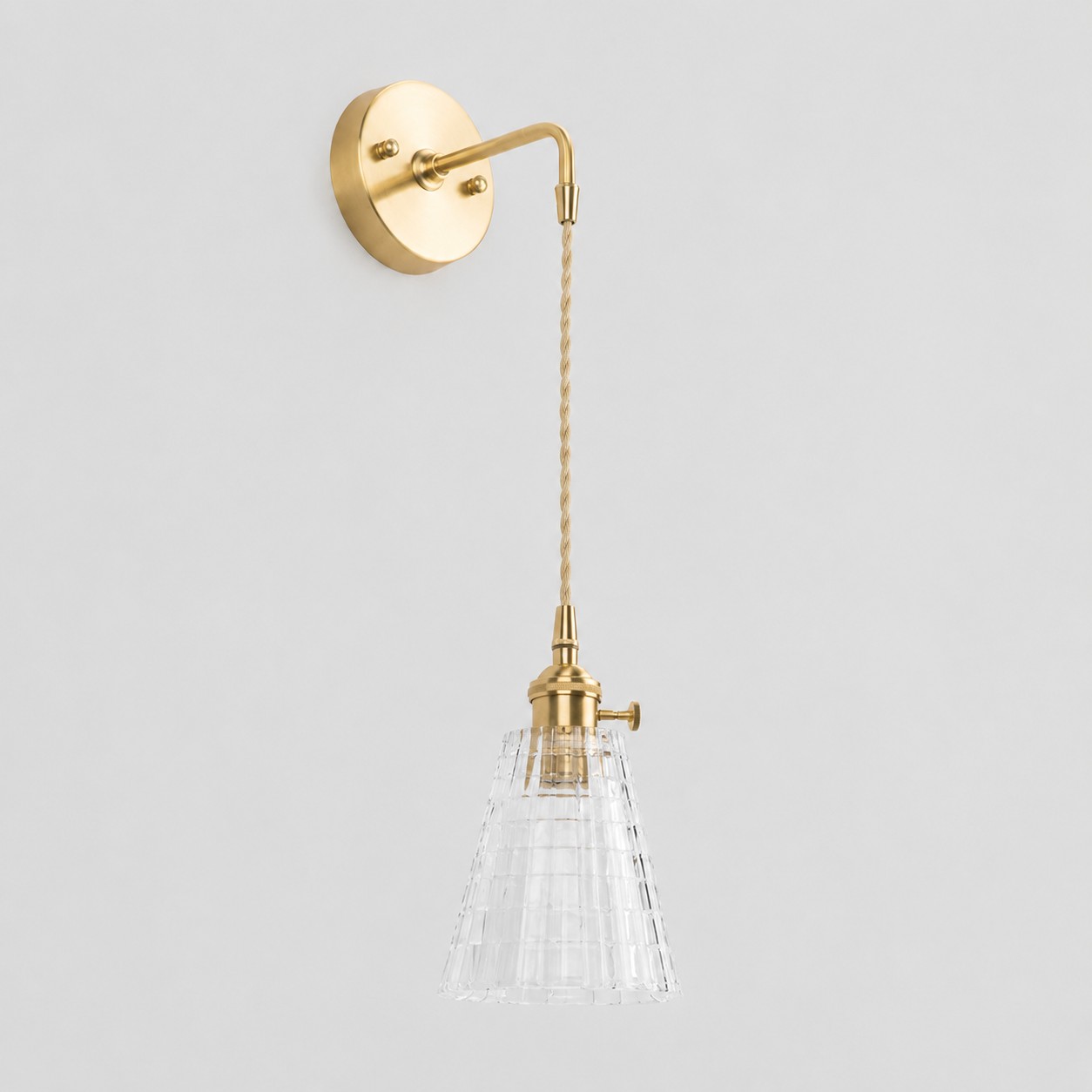 Clear glass wall light with brass arm, EW shade 13 cm high and 12 cm diameter