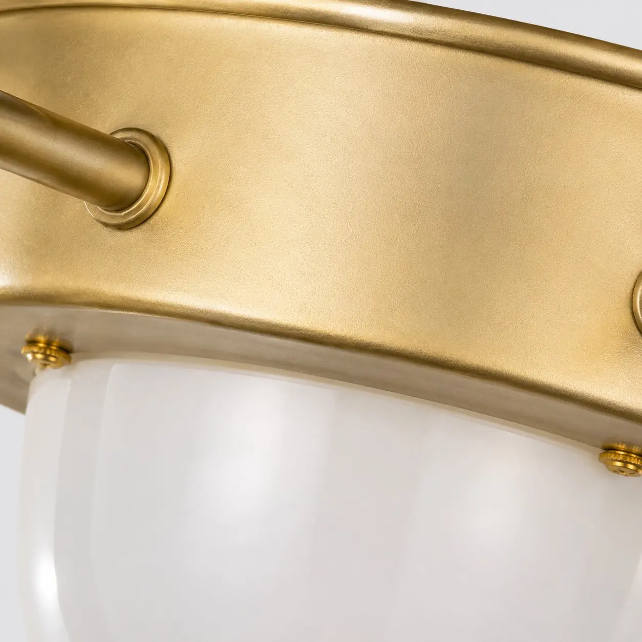 Close-up of the brushed gold iron ceiling plate