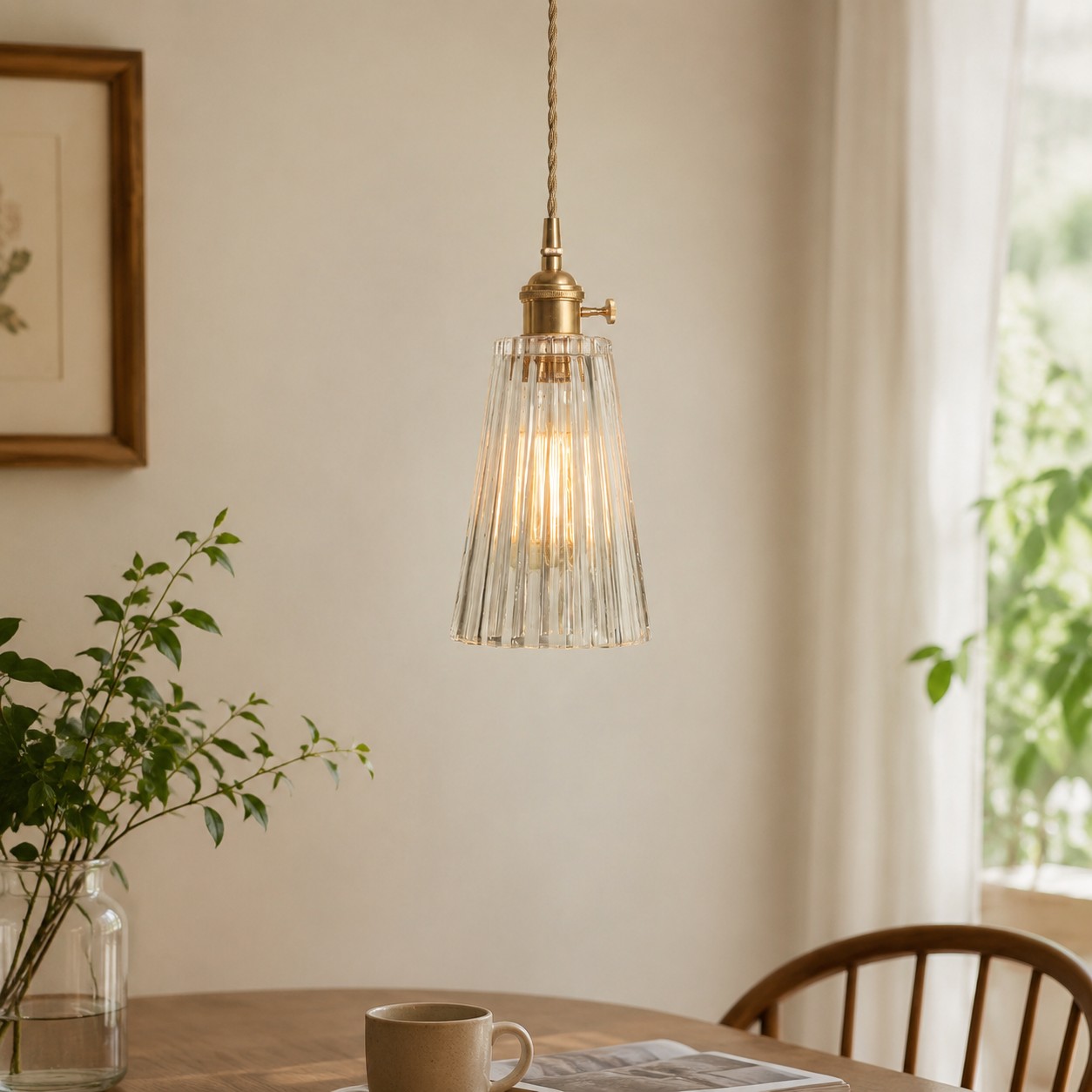 Style G vertically ribbed glass pendant beside a softly lit window