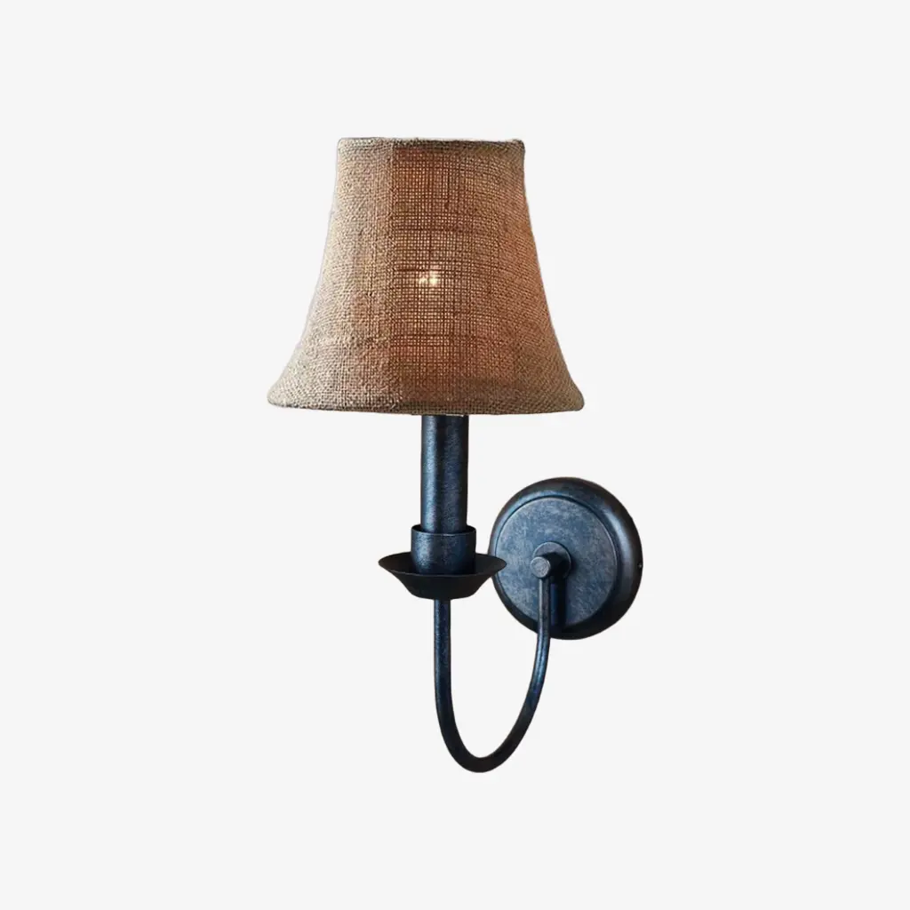 Antique brass wall sconce with A linen shade