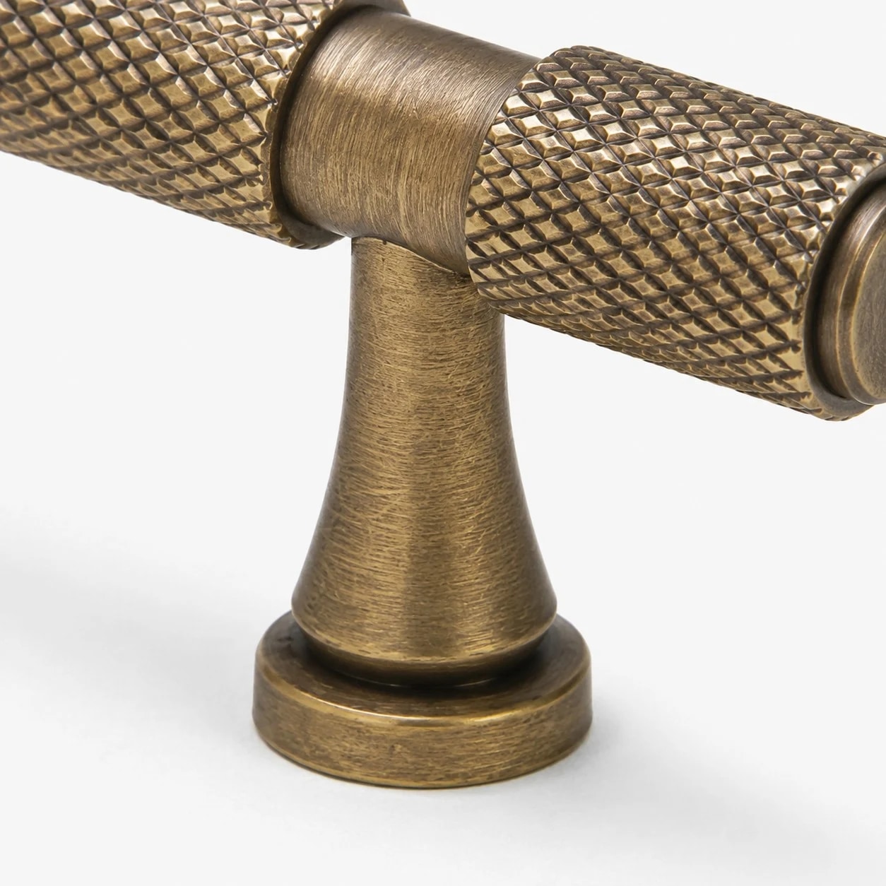 Antique brass cabinet pull mounting foot detail